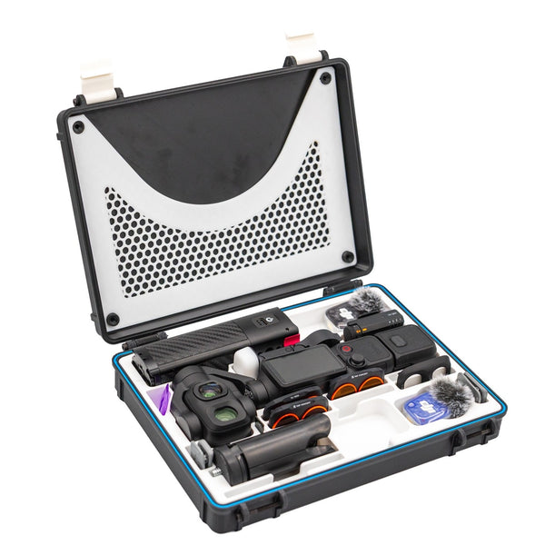 DJI Osmo Pocket 4 Pro Ultimate Rugged Case open on white, with the Pocket 4 Pro, battery grip, ND filters, wireless mics and tripod grip seated in the white TPU insert and the honeycomb lid organiser above