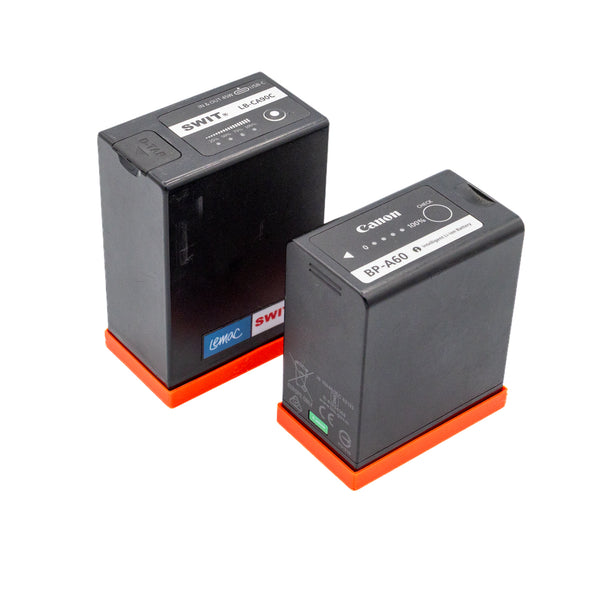 Canon BP-A60 and SWIT LB-CA90C batteries fitted with red TPU battery caps